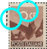 “ segno di colore nel fondo sopra il manico del martello, a sinistra grosso punto chiaro nel fondo sopra 0 di 10 “